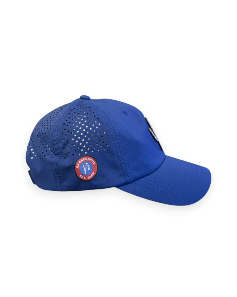 V's Barbershop blue dad hat with perforated side panels and a cactus patch, featuring a circular logo side detail.