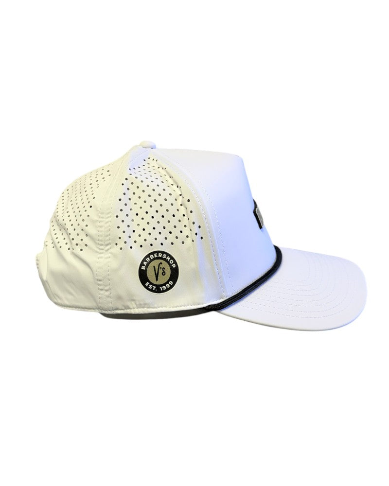 V's Barbershop white 5-panel performance hat with perforated side panels, black rope detail, and side logo patch.