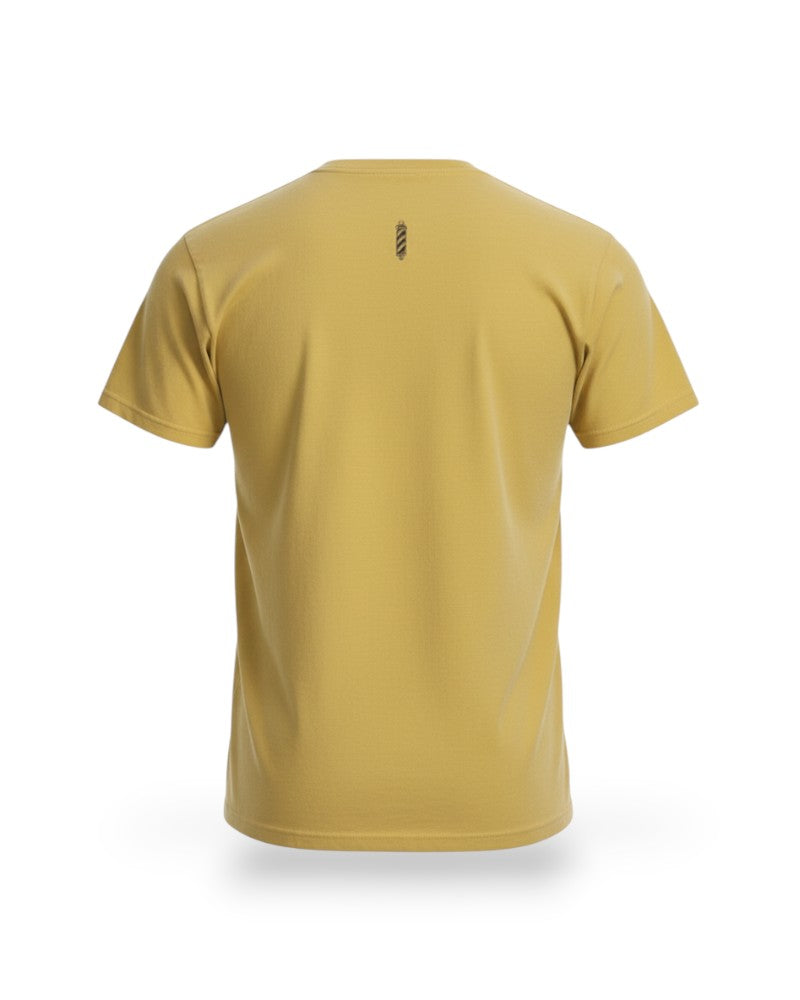 V's Barbershop butter yellow cotton t-shirt with a small barber pole logo on the back.